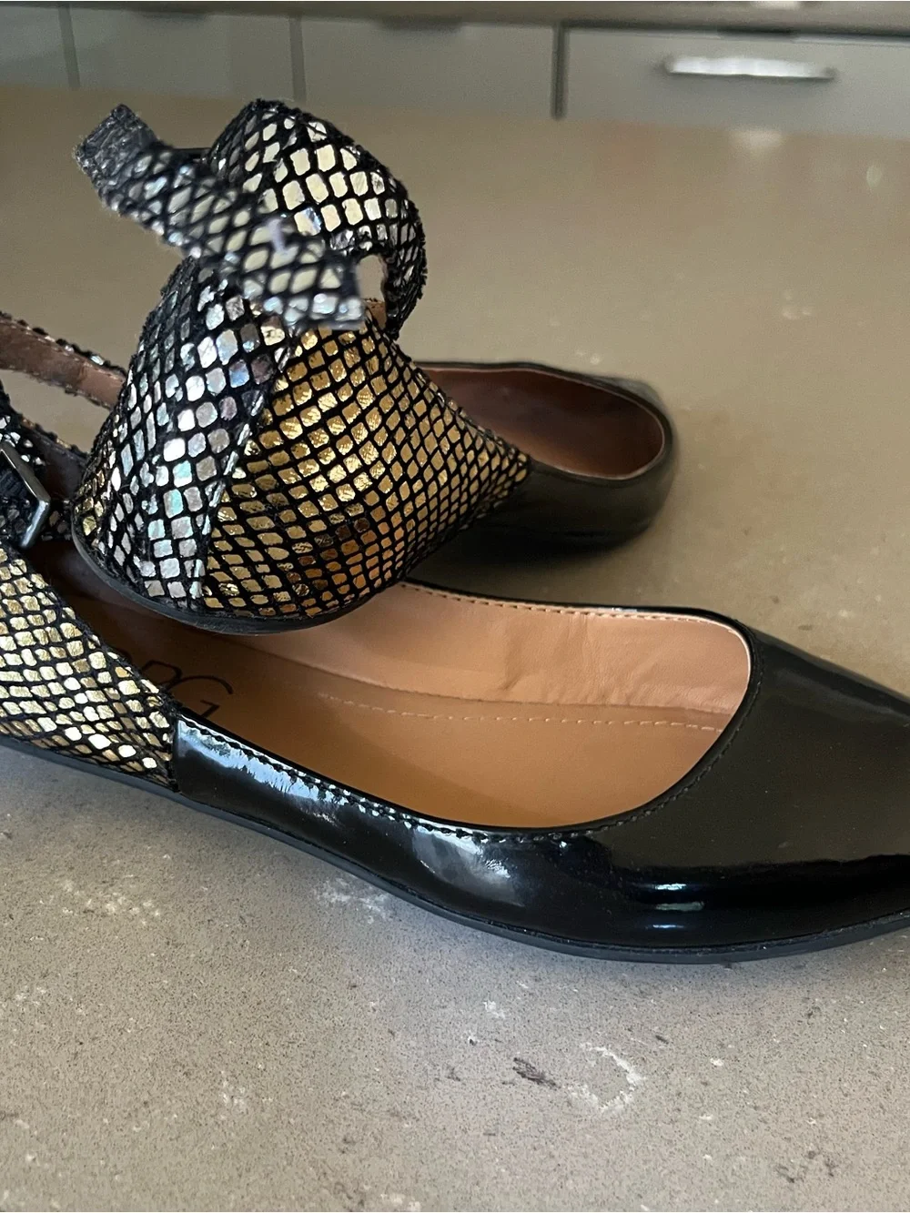 BCBG Black Patent Pointed Toe Flats with Metallic Snakeskin Ankle Strap